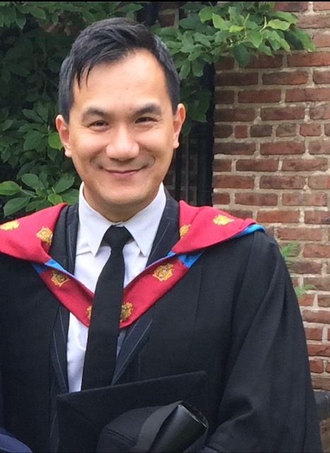 Gentleman wearing Graduate robes